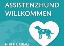 Ein gr&uuml;ner Aufkleber mit wei&szlig;er Schrift  "Assistenzhund willkommen" und der Zeichnung eines Hundes in einem Herz.